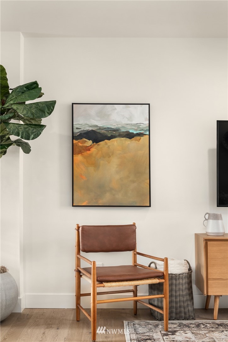 18517 96th Drive Northeast, Unit A Bothell, WA 98011 - Photo 21 of 31 a living room with furniture and a flat screen tv