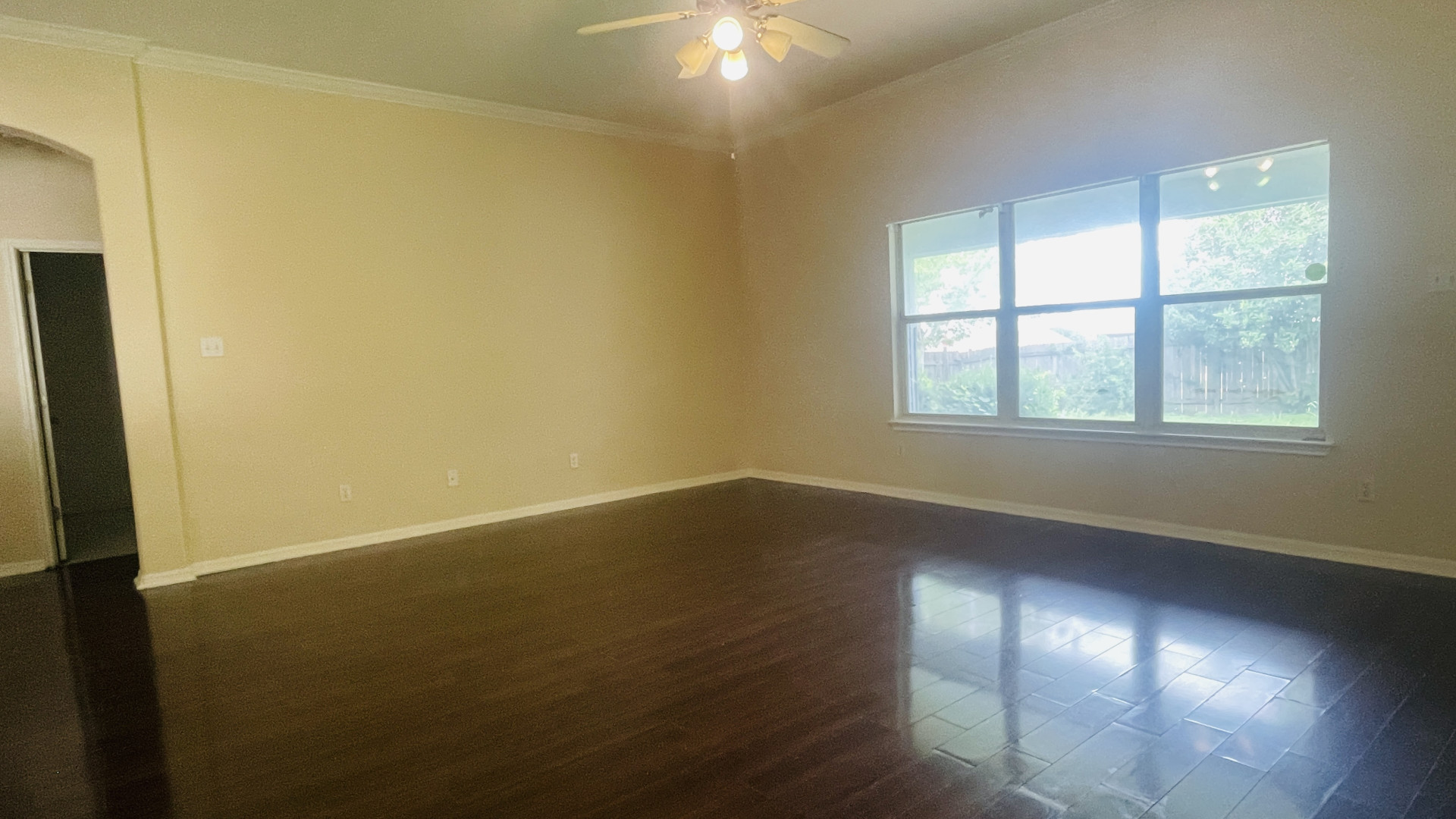 6805 Cromarty Lane Austin, TX 78754 - Photo 8 of 18 an empty room with wooden floor and windows