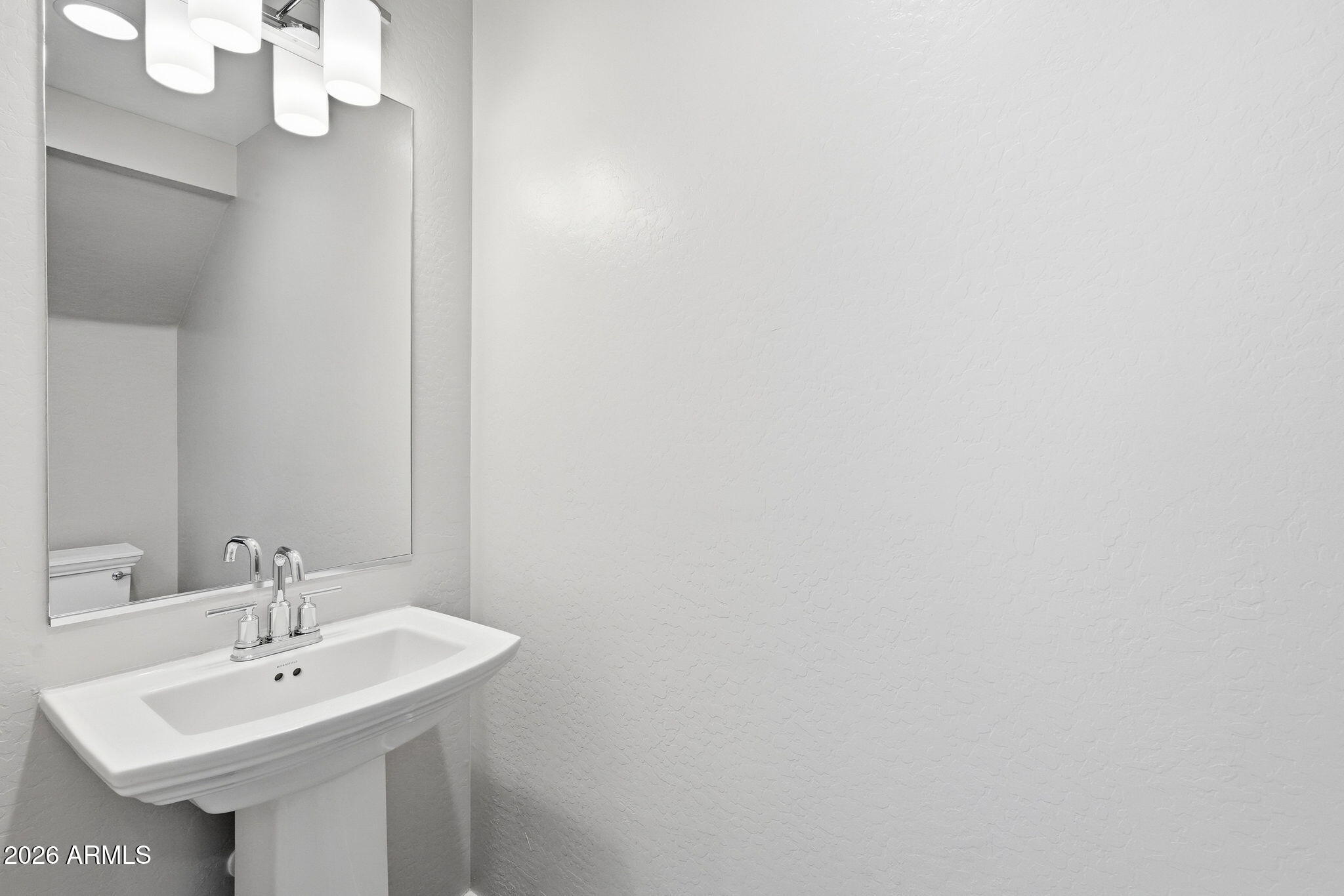 901 South Smith Road, Unit 1038 Tempe, AZ 85281 - Photo 13 of 29 a bathroom with a sink and a mirror