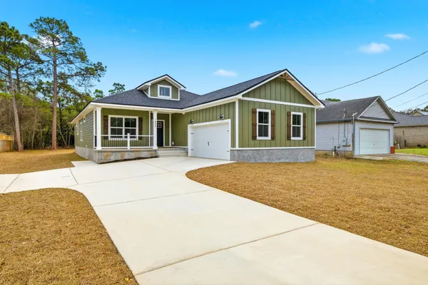 a front view of a house with yard