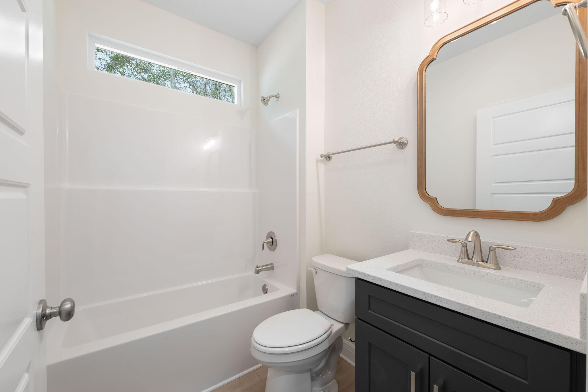 1854 Wheeler Road Gulf Breeze, FL 32563 - Photo 11 of 11 a bathroom with a sink a toilet and a mirror