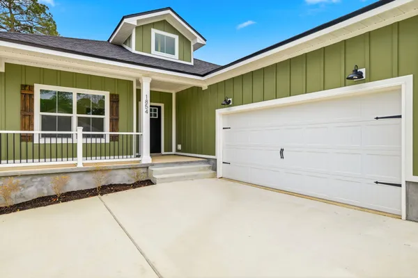 a front view of a house with a garage