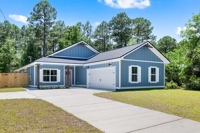 a front view of a house with yard