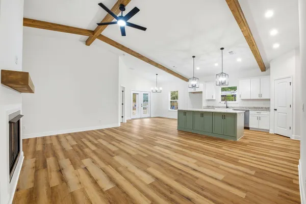a view of kitchen with cabinets and wooden floor