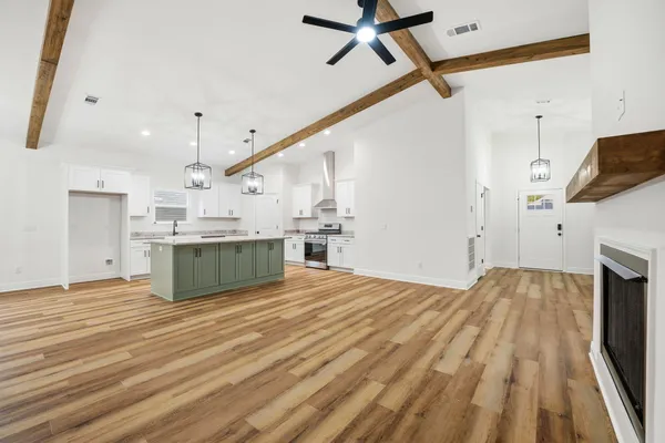 a view of kitchen with microwave and stove