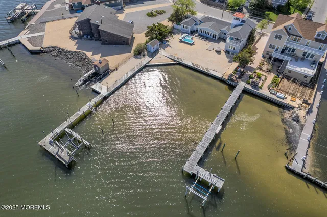 an aerial view of a house with a ocean view