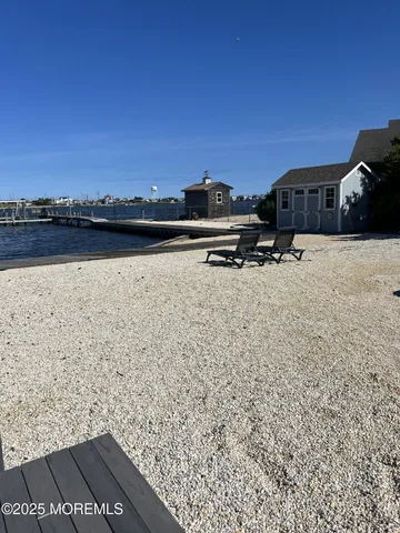 a living room with furniture and a kitchen view