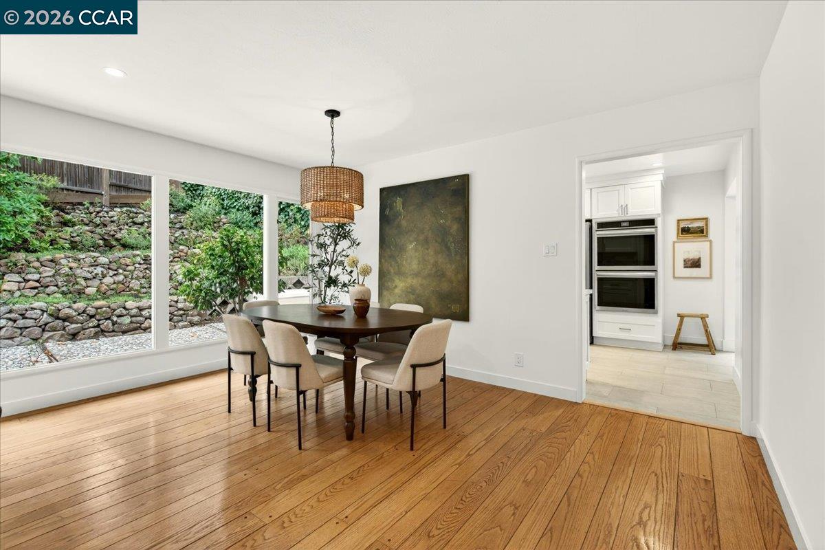 24 Las Vegas Road Orinda, CA 94563 - Photo 9 of 47 a view of a dining room with furniture window and wooden floor