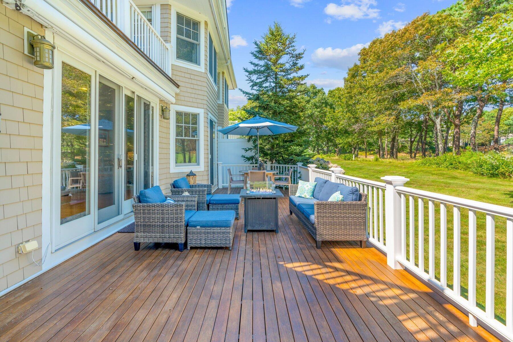 9 Vineyard Reach Mashpee, MA 02649 - Photo 11 of 60 a view of a house with wooden floor and outdoor seating