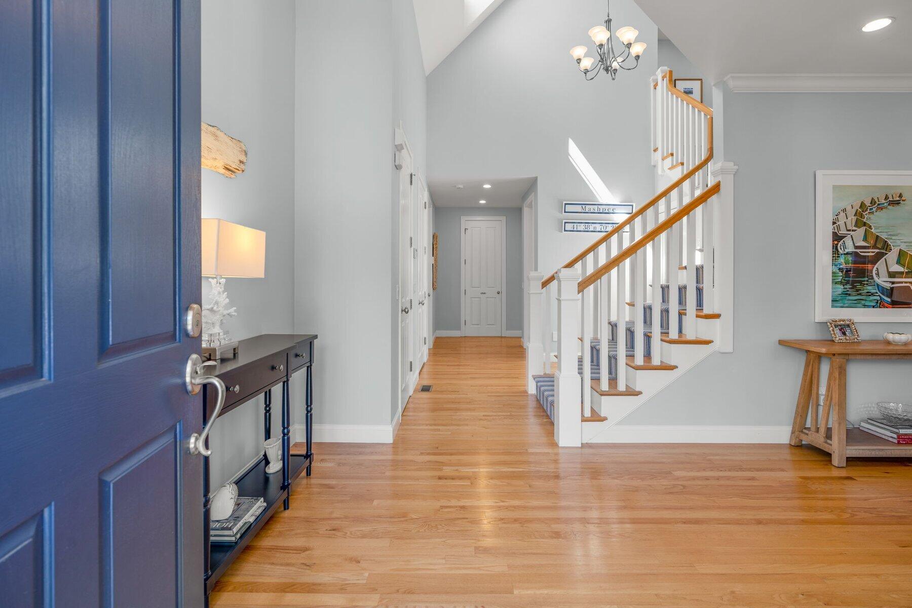 9 Vineyard Reach Mashpee, MA 02649 - Photo 20 of 60 a view of a hallway with wooden floor and staircase