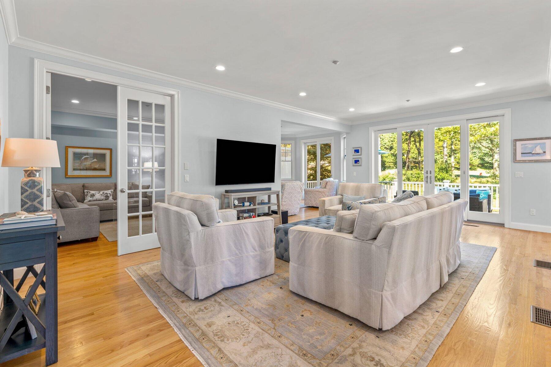9 Vineyard Reach Mashpee, MA 02649 - Photo 24 of 60 a living room with furniture and a flat screen tv
