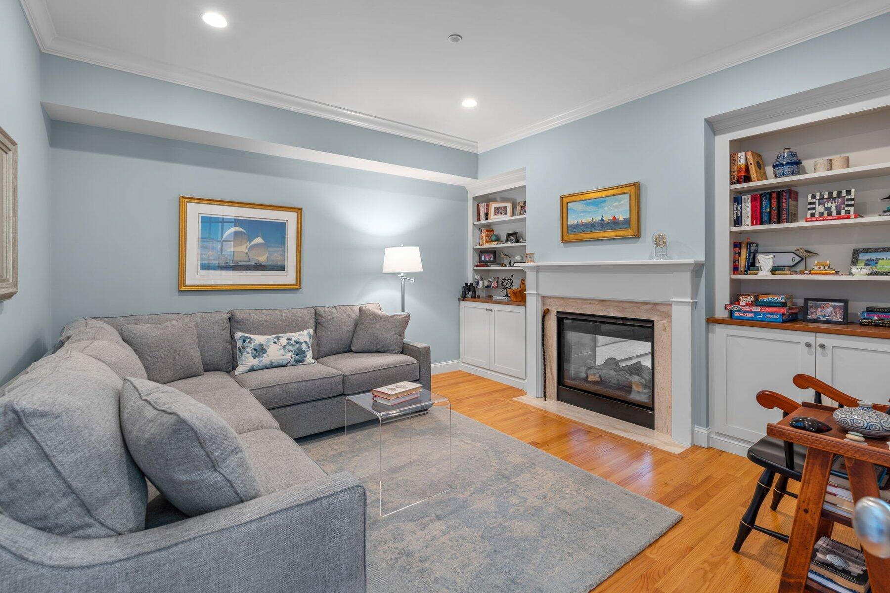 9 Vineyard Reach Mashpee, MA 02649 - Photo 27 of 60 a living room with furniture and a fireplace