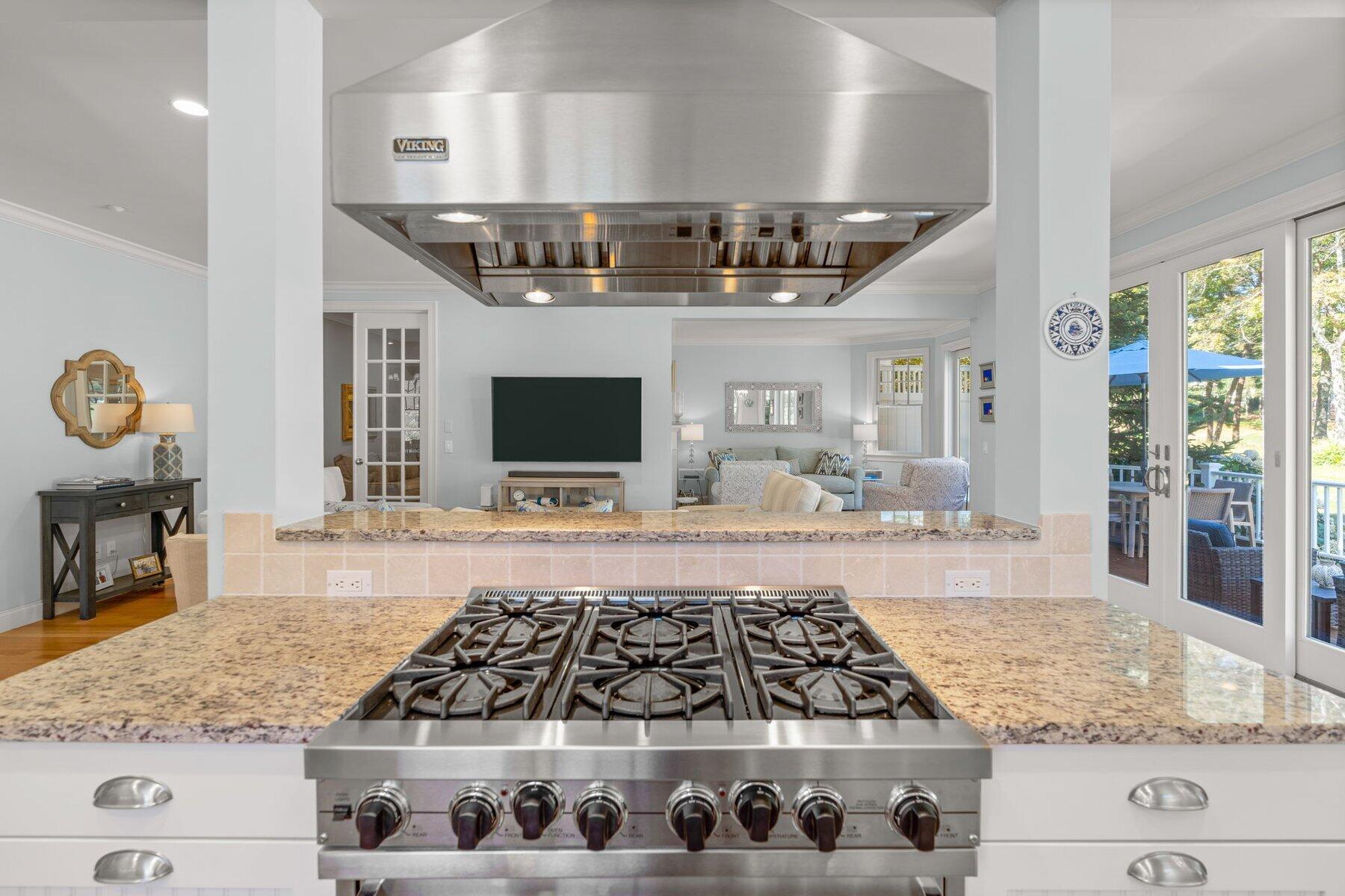 9 Vineyard Reach Mashpee, MA 02649 - Photo 31 of 60 a kitchen with stainless steel appliances granite countertop a stove and a wooden cabinets