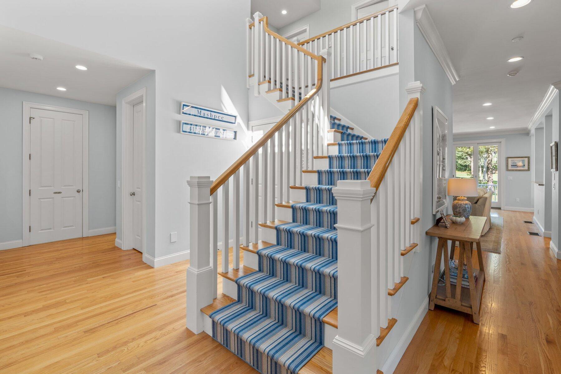 9 Vineyard Reach Mashpee, MA 02649 - Photo 37 of 60 a view of entryway with wooden floor and stairs