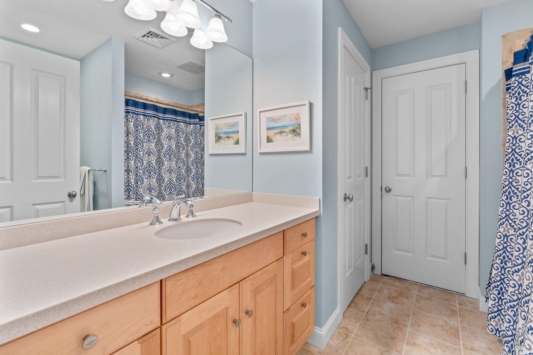 9 Vineyard Reach Mashpee, MA 02649 - Photo 40 of 60 a bathroom with a sink a vanity and a mirror