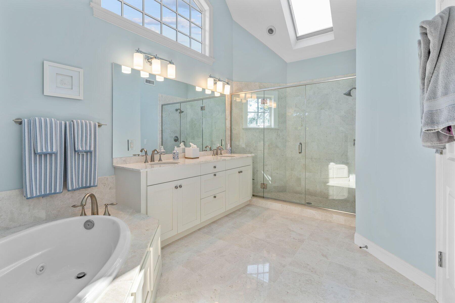 9 Vineyard Reach Mashpee, MA 02649 - Photo 47 of 60 a spacious bathroom with a tub sink and mirror