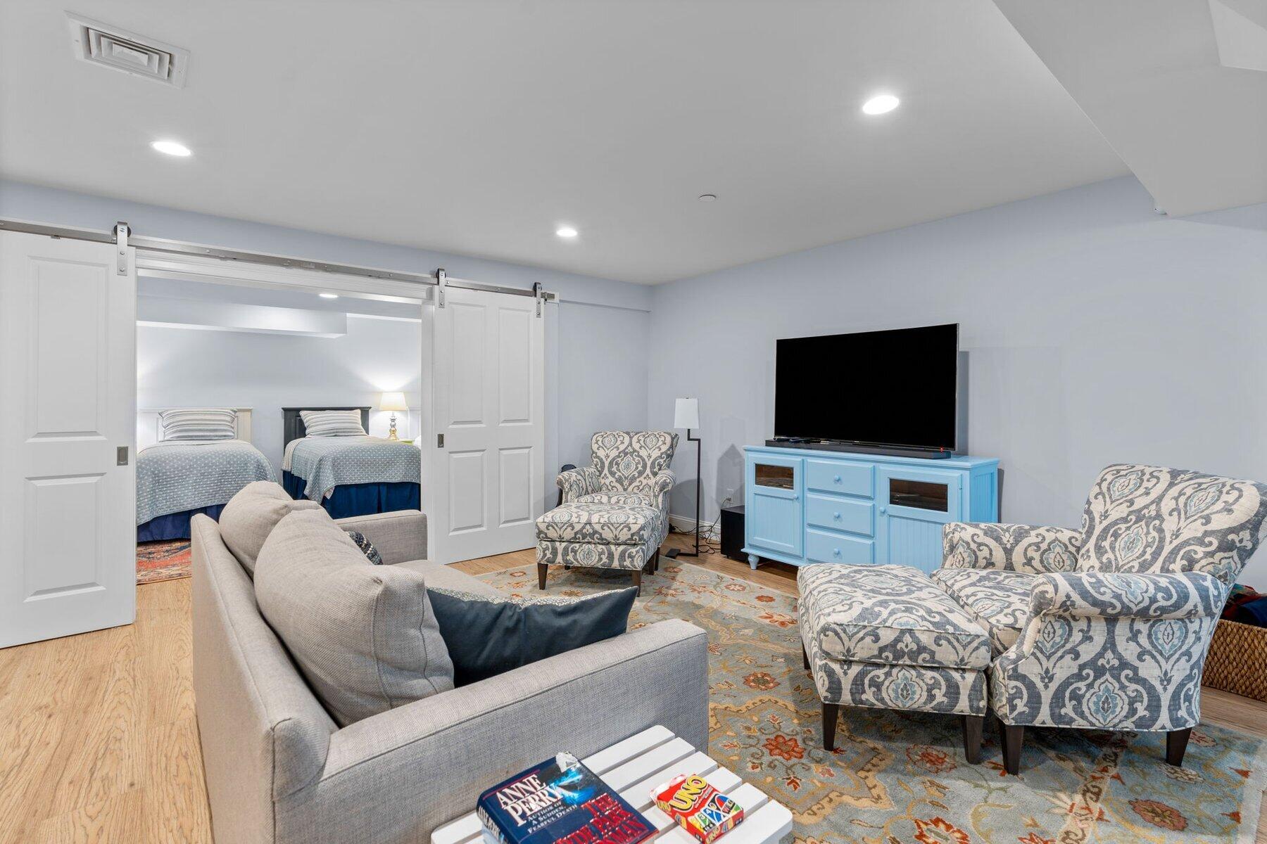 9 Vineyard Reach Mashpee, MA 02649 - Photo 50 of 60 a living room with furniture and a flat screen tv