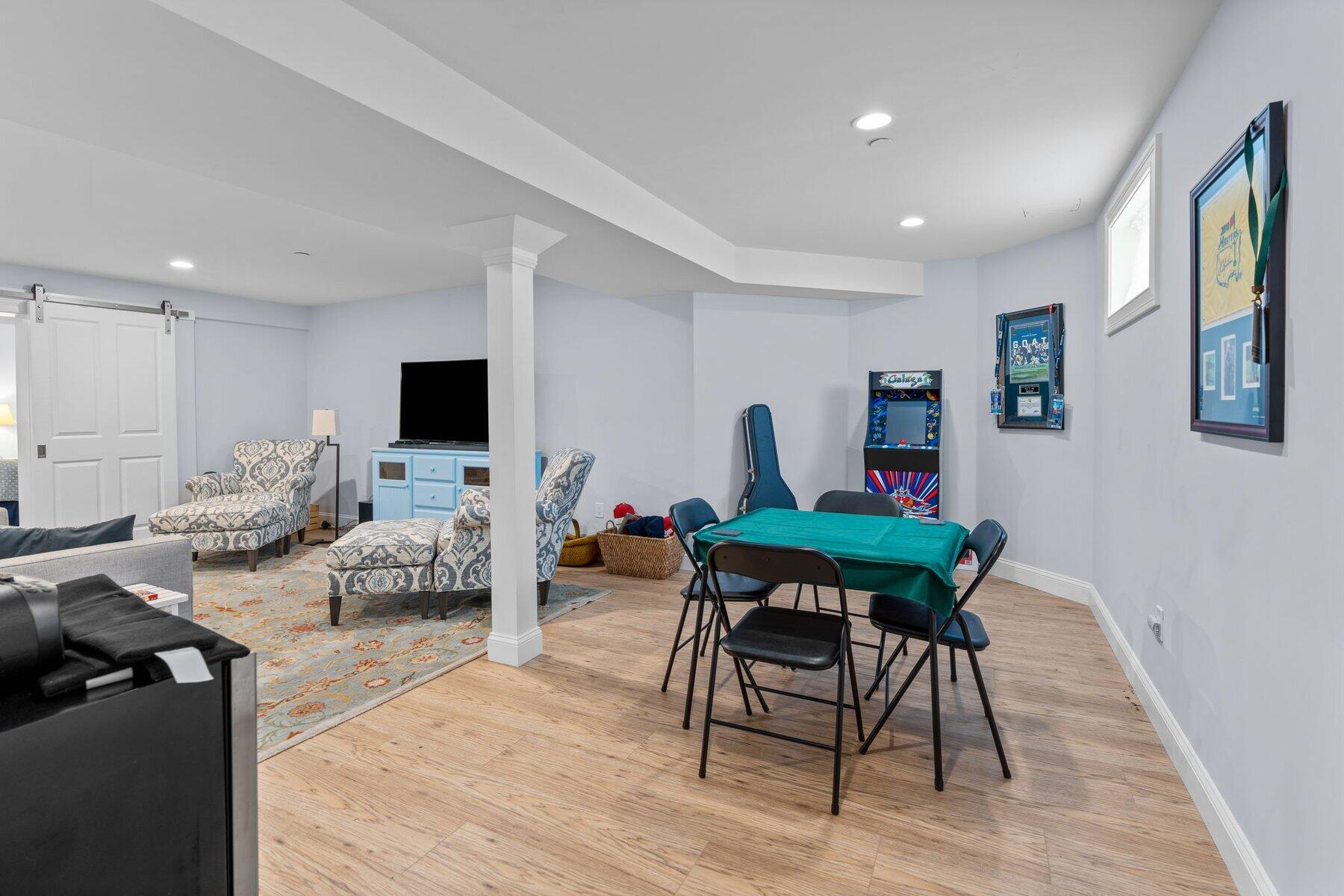 9 Vineyard Reach Mashpee, MA 02649 - Photo 51 of 60 a living room with furniture and a flat screen tv