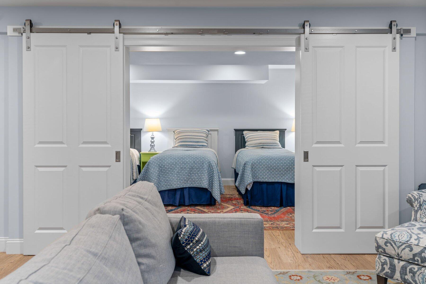 9 Vineyard Reach Mashpee, MA 02649 - Photo 55 of 60 a bedroom with a bed and a mirror