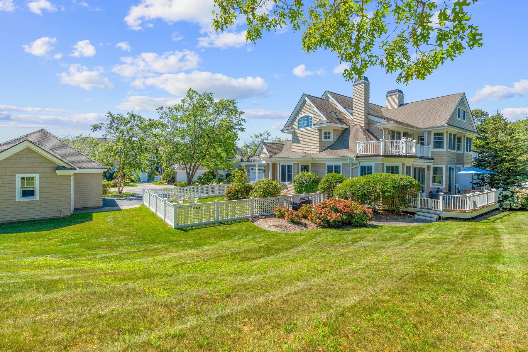 9 Vineyard Reach Mashpee, MA 02649 - Photo 7 of 60 a view of a house with a yard and sitting area