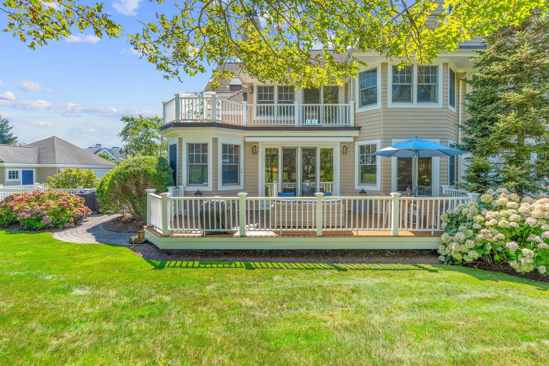 9 Vineyard Reach Mashpee, MA 02649 - Photo 8 of 60 a view of a house with a backyard and deck