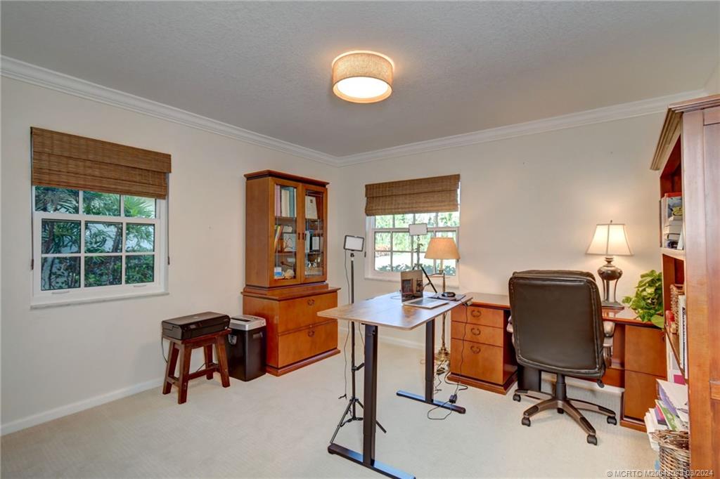 5 Banyan Road Stuart, FL 34996 - Photo 28 of 49 a view of a workspace with furniture and a window