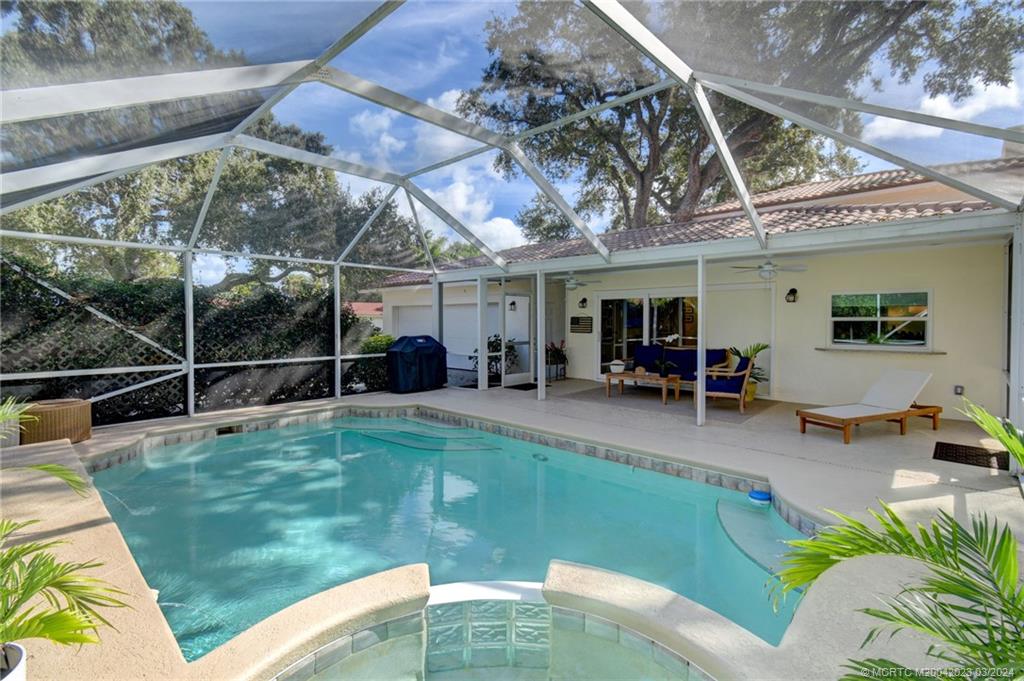 5 Banyan Road Stuart, FL 34996 - Photo 36 of 49 a view of a backyard with swimming pool