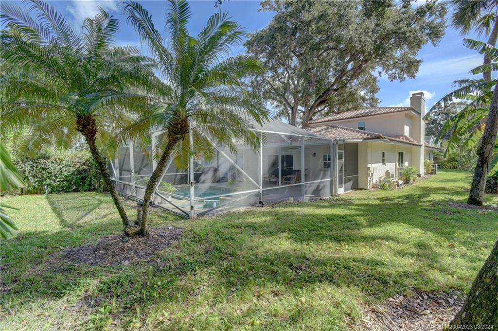 5 Banyan Road Stuart, FL 34996 - Photo 39 of 49 a view of a house with a yard