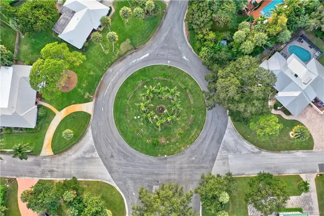 a view of a lake with houses in back