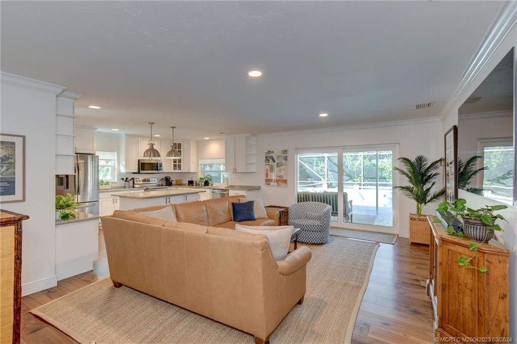 5 Banyan Road Stuart, FL 34996 - Photo 9 of 49 a living room with furniture and a large window