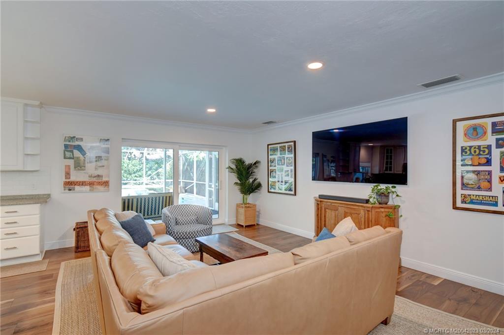 5 Banyan Road Stuart, FL 34996 - Photo 10 of 49 a living room with furniture and a flat screen tv