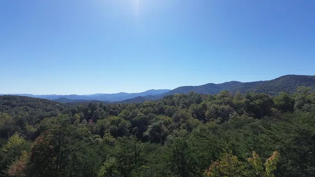 a view of a town with mountains in the background