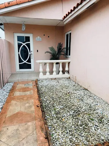 a view of entryway with stairs and a window