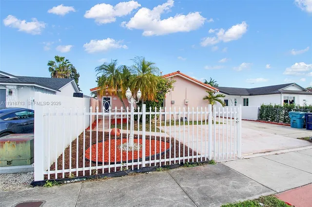 a view of a wrought iron fences in front of house