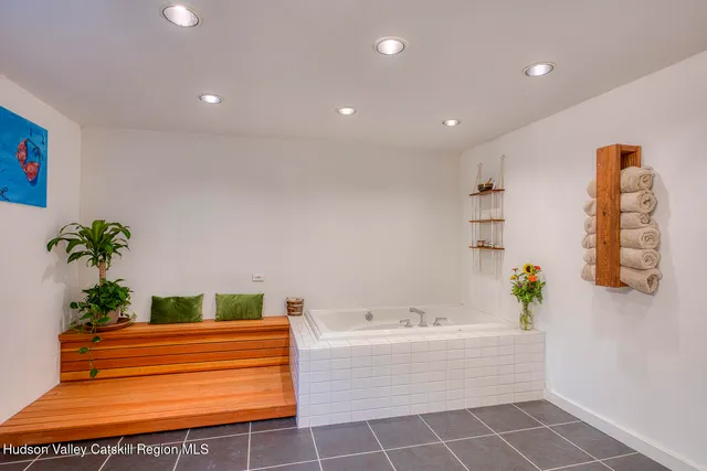 a bathroom with a toilet a sink and a mirror