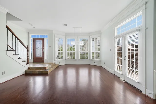 a view of an entryway with wooden floor