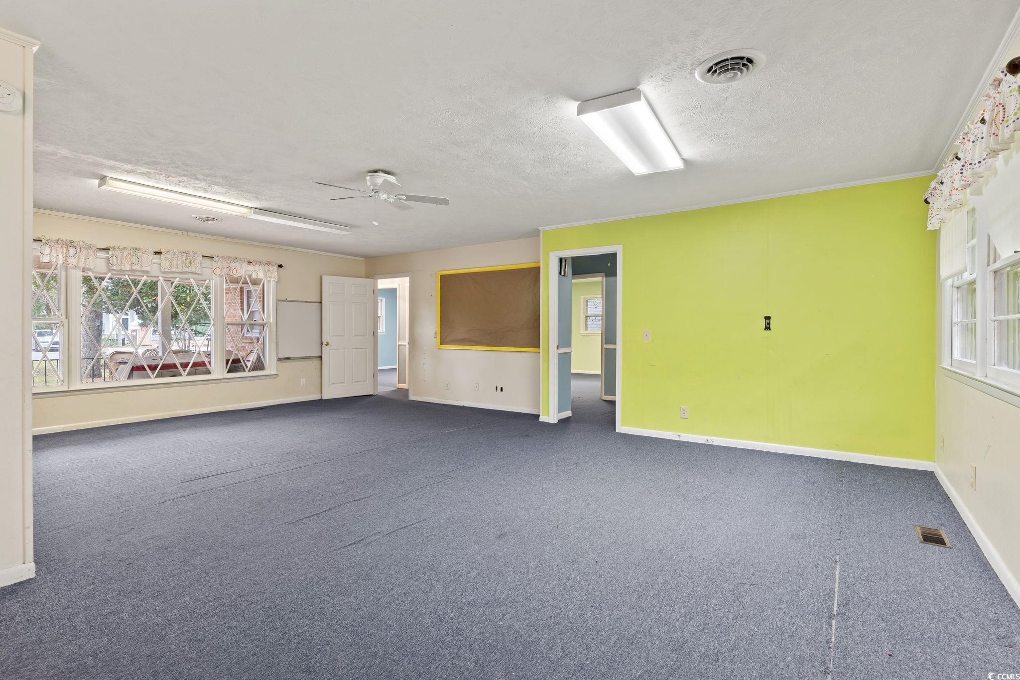 813 Bellamy Road North Myrtle Beach, SC 29582 - Photo 12 of 29 Carpeted empty room featuring a textured ceiling a