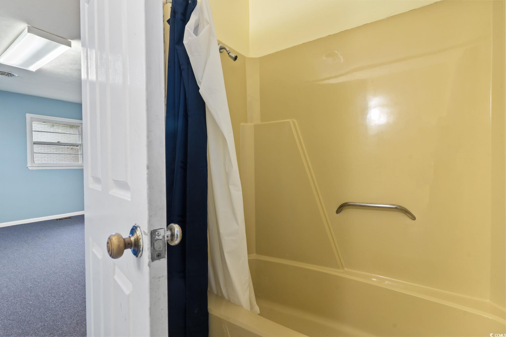 813 Bellamy Road North Myrtle Beach, SC 29582 - Photo 16 of 29 Bathroom featuring shower / bath combo