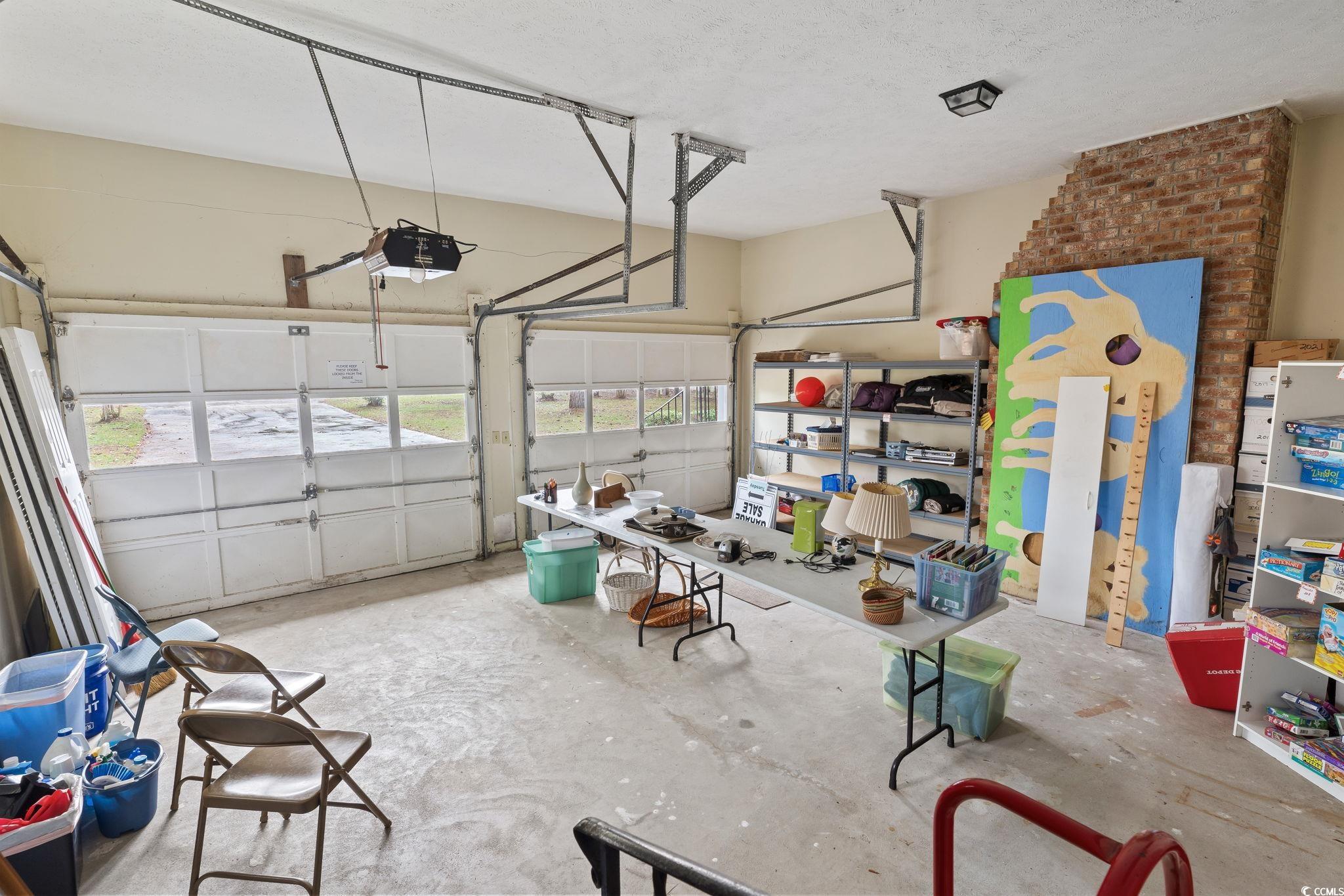 813 Bellamy Road North Myrtle Beach, SC 29582 - Photo 20 of 29 Garage with a garage door opener