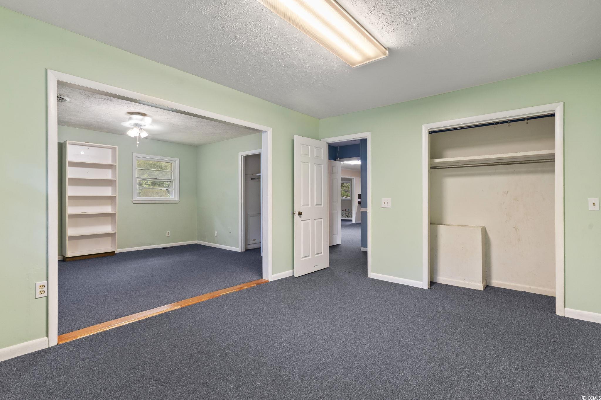 813 Bellamy Road North Myrtle Beach, SC 29582 - Photo 23 of 29 Unfurnished bedroom with a textured ceiling, dark