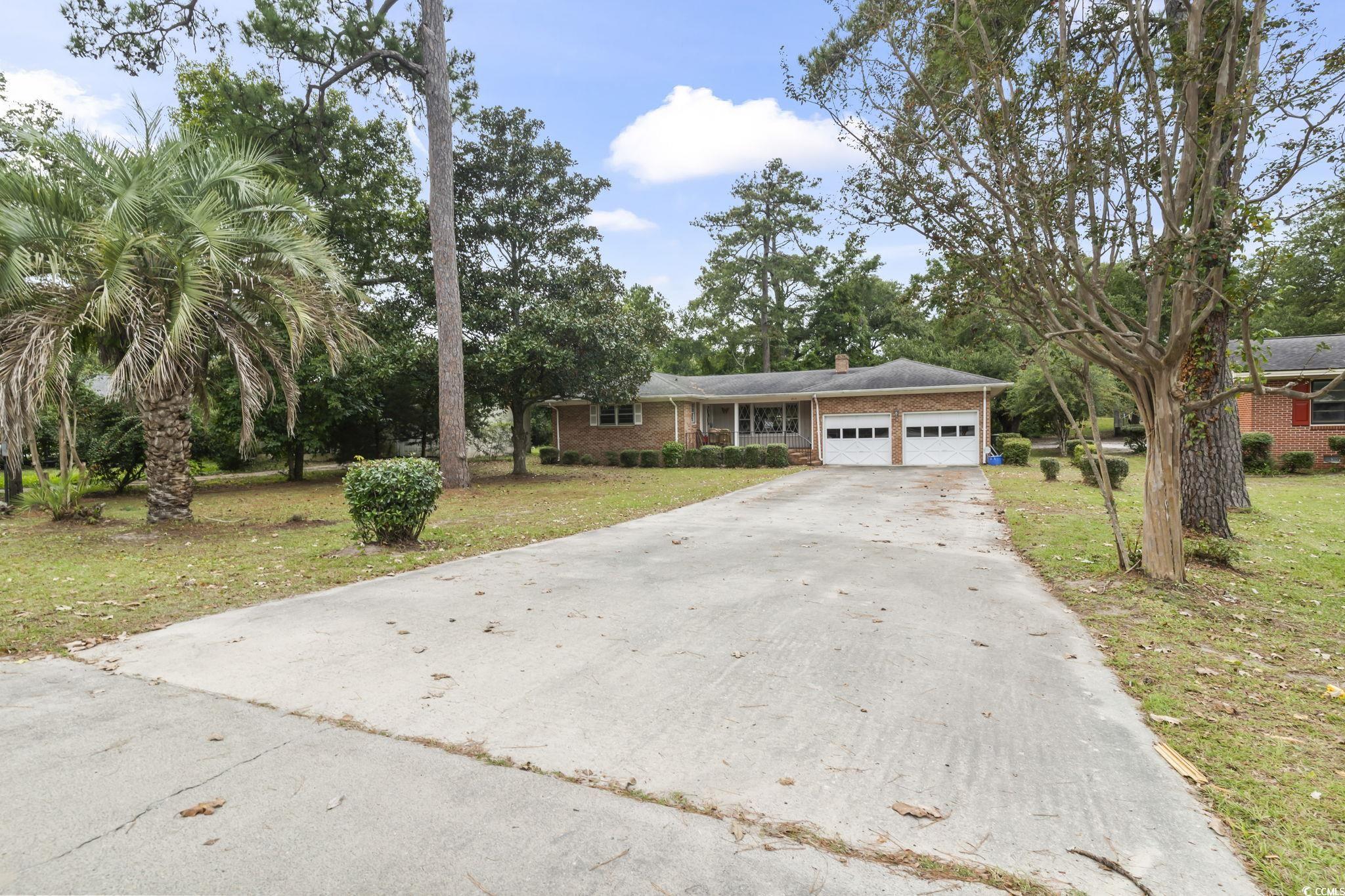 813 Bellamy Road North Myrtle Beach, SC 29582 - Photo 24 of 29 Ranch-style house featuring a garage and a front l
