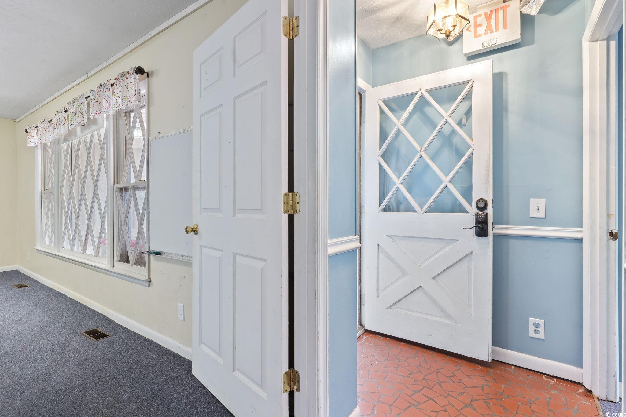 View of carpeted foyer