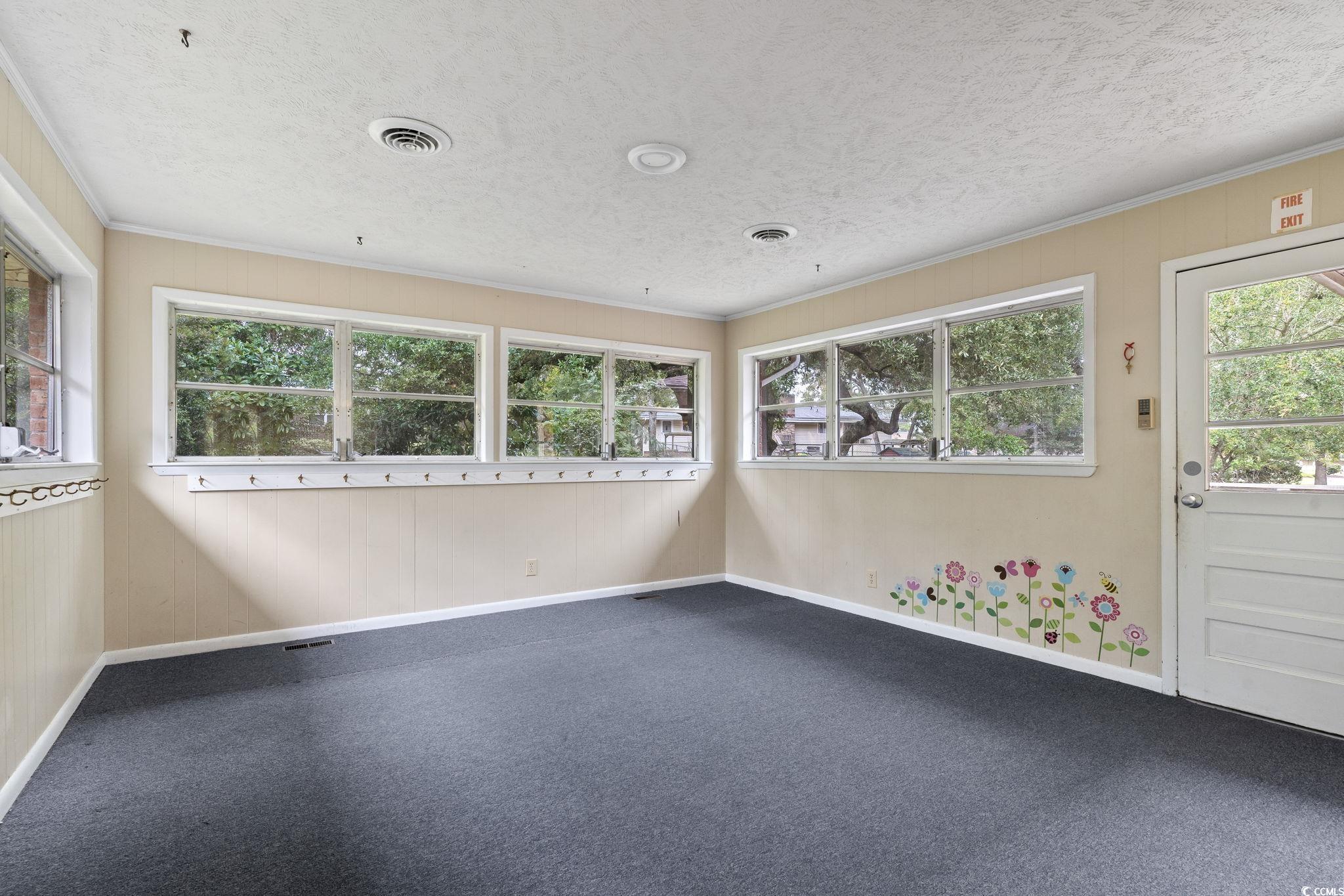 813 Bellamy Road North Myrtle Beach, SC 29582 - Photo 10 of 29 Carpeted spare room featuring a textured ceiling,