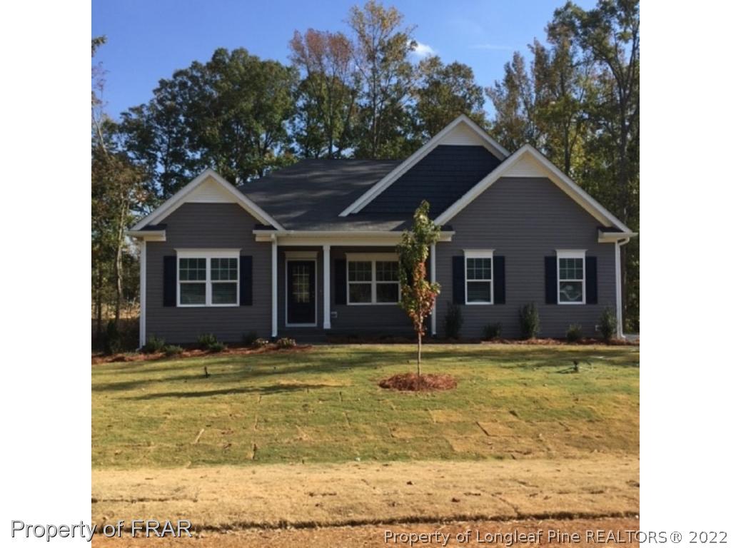 311 Copper Ridge Drive Sanford, NC 27330 - Photo 1 of 2 a view of a house with a swimming pool