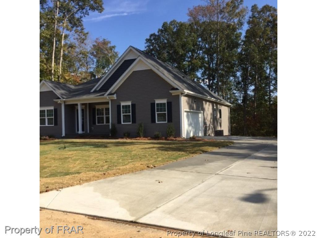 311 Copper Ridge Drive Sanford, NC 27330 - Photo 2 of 2 a view of a house with backyard and trees