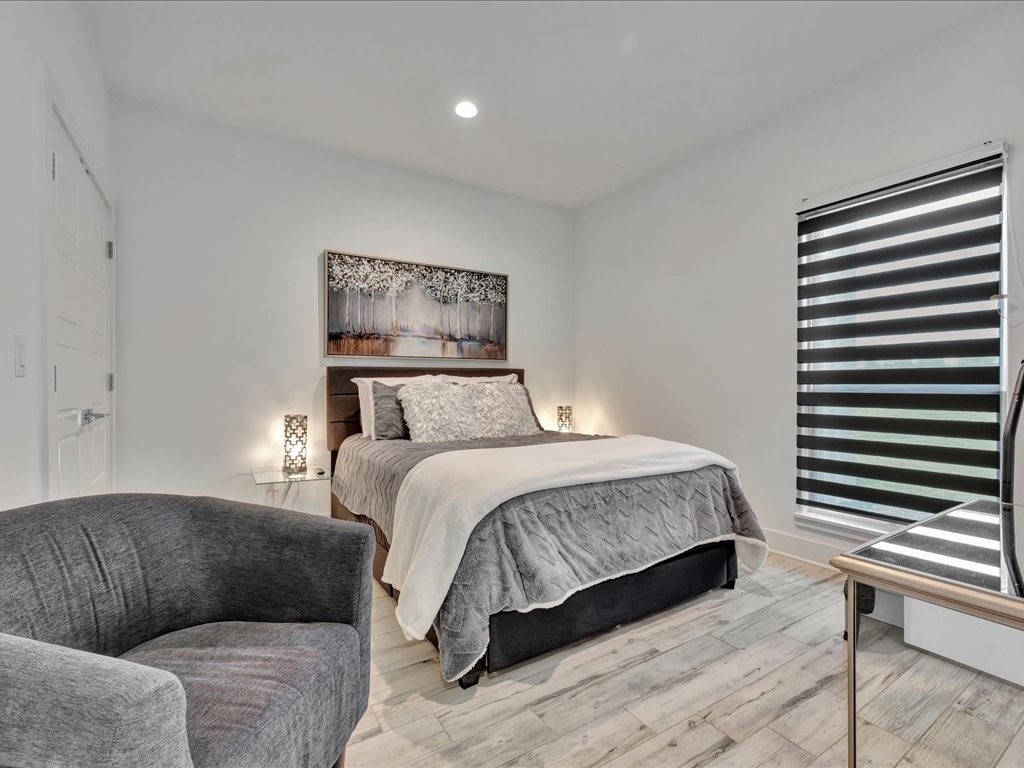 129 White Oak Loop Lufkin, TX 75901 - Photo 12 of 50 a bedroom with a bed and a couch