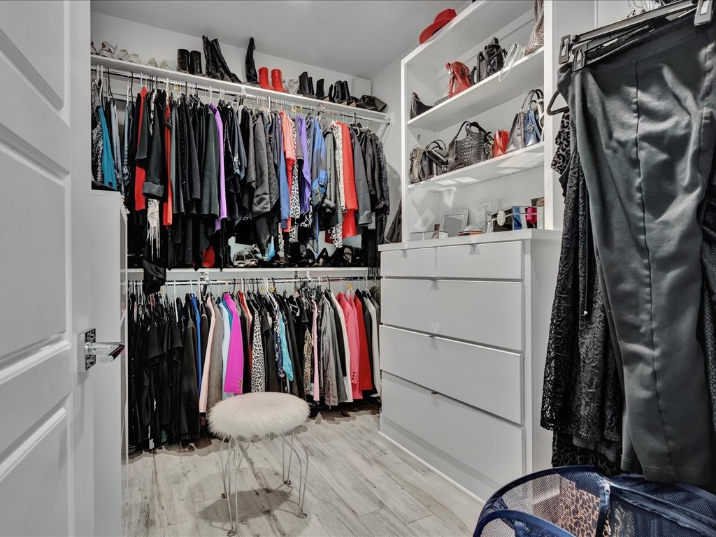 129 White Oak Loop Lufkin, TX 75901 - Photo 13 of 50 a view of walk in closet with clothes and shoes