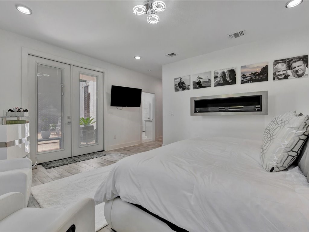 129 White Oak Loop Lufkin, TX 75901 - Photo 15 of 50 a spacious bedroom with a bed and a view of living room