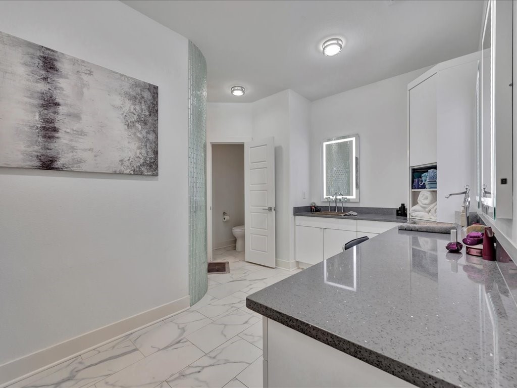 129 White Oak Loop Lufkin, TX 75901 - Photo 16 of 50 a kitchen with stainless steel appliances granite countertop a sink and a refrigerator