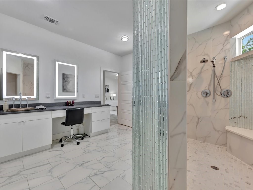 129 White Oak Loop Lufkin, TX 75901 - Photo 18 of 50 a bathroom with a granite countertop sink a toilet and shower